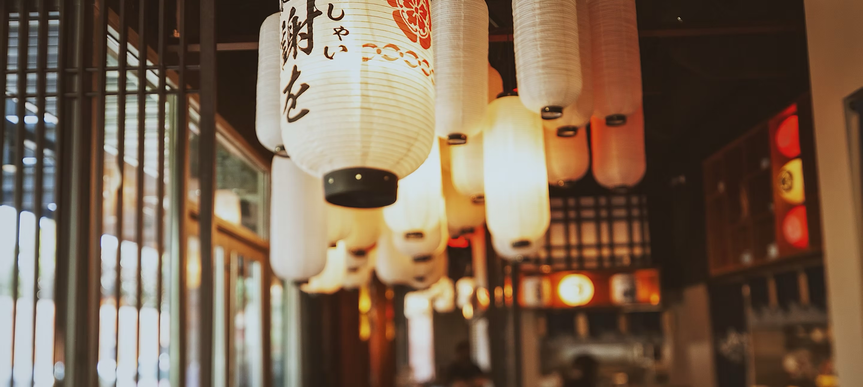 Glowing paper lanterns hanging through the dining room